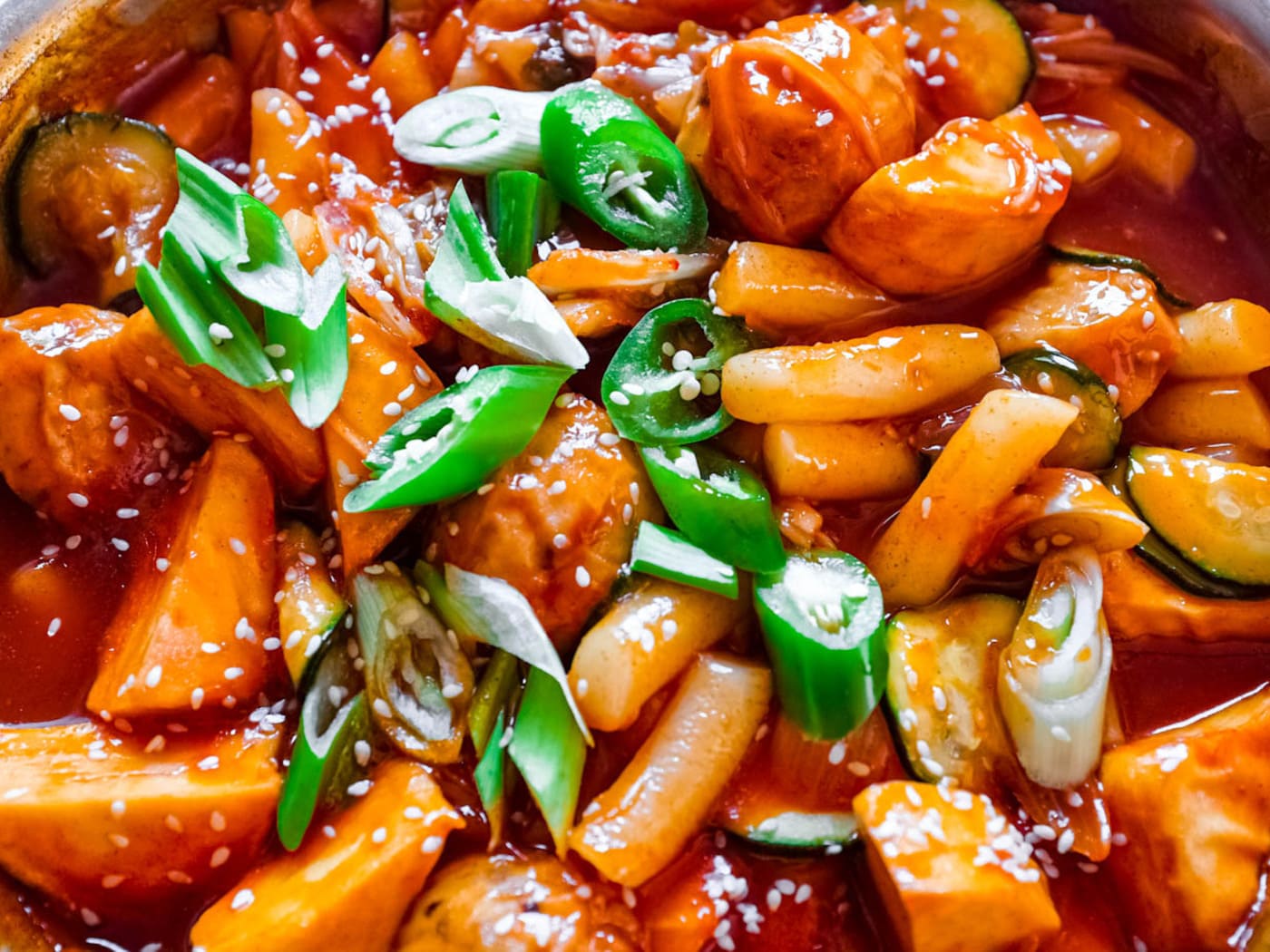 Tteokbokki: Korean rice cake simmered in spicy sauce